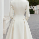 Elegantna dvostruko kopčana kaput-haljina