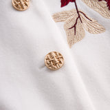 Chic bijeli sako s crvenim ružama